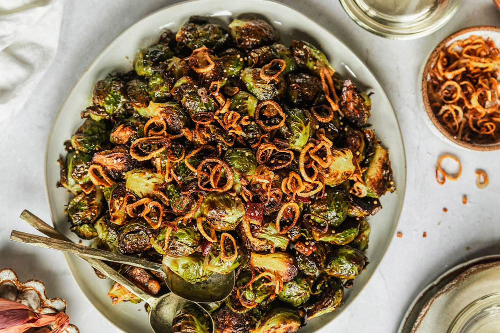 Charred Brussels Sprouts with Miso-Caramel Glaze, Black Garlic Soil, and Crispy Shallot