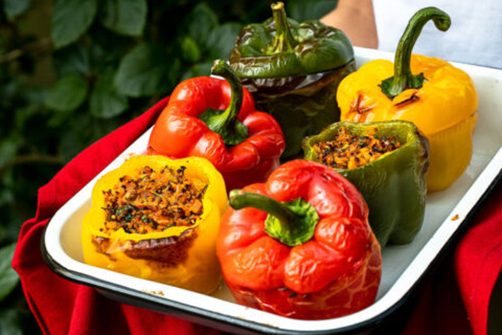 Quinoa-Stuffed Bell Peppers with Turmeric-Tahini Sauce
