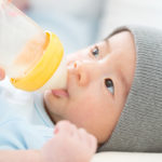 Breastfeeding, Mother feeding baby with milk bottle
