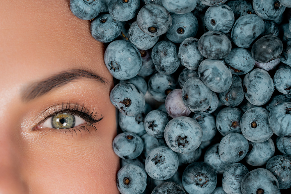 half woman face in fresh ripe berries blueberrie 2023 11 27 05 35 27 utc