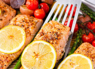 Zesty Lemon Herb Salmon Over a Rainbow of Roasted Veggies